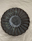 Rinka Plate by Yoshida Pottery with nature-inspired design on table setting.