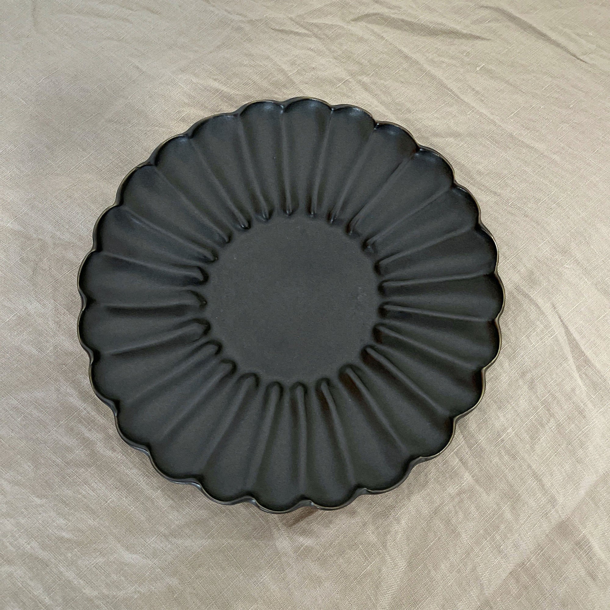 Elegant Rinka Plate by Yoshida Pottery with nature-inspired scalloped design, adding sophistication to any table setting.