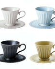 Four Storia Tall Coffee Cups & Saucers in white, blue, black, and beige, showcasing elegant porcelain design with antique lacquer finish.