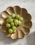 Rinka Plate by Kaneko Kohyo holding green grapes, handmade in Japan, microwave and dishwasher safe, unique glaze finish.
