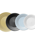 Four Storia Plates in various colors, showcasing elegant lace edges and a flecked lacquer finish, evoking nostalgia and romance.