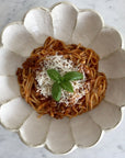 Rinka Bowl by Kaneko Kohyo with pasta and basil garnish, showcasing unique handmade glaze texture. Microwave and dishwasher safe.