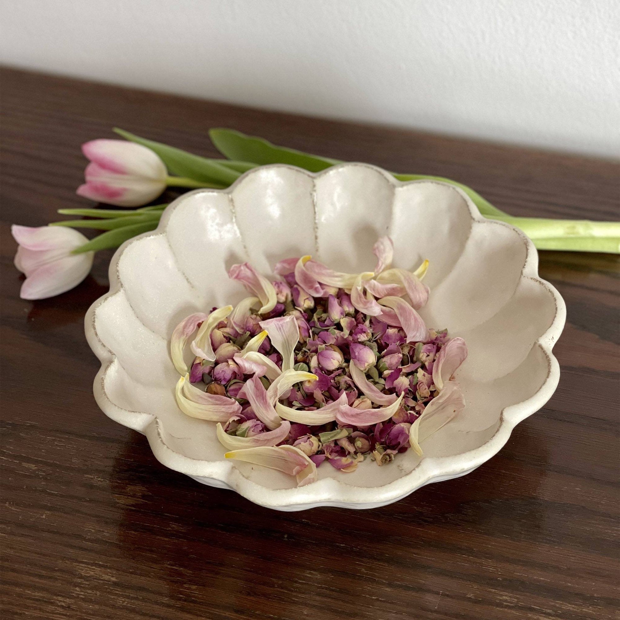 Rinka Bowl 24cm by Kaneko Kohyo, delicate porcelain with floral design, filled with flower petals, enhancing any table setting.