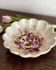 Rinka Bowl 24cm by Kaneko Kohyo, delicate porcelain with floral design, filled with flower petals, enhancing any table setting.