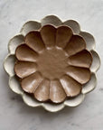 Stoneware Rinka Plates Stacked on Marble Surface, Showcasing Handcrafted Japanese Design and Timeless Elegance