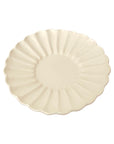 Elegant Rinka Plate by Yoshida Pottery with nature-inspired patterns, crafted by ceramist Masakazu Yoshida, adding style to table settings.