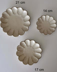 Decorative Rinka plates in 21cm, 17cm, and 14cm sizes, showcasing elegant craftsmanship and design.