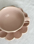 Delicate porcelain Rinka soup cup with flower shape, handcrafted by Kaneko Kohyo, matching saucer, Rinka Collection, pink hue.
