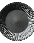Elegant black porcelain plate with scalloped edge design, 27cm diameter, evoking antique flatware nostalgia and sophistication.
