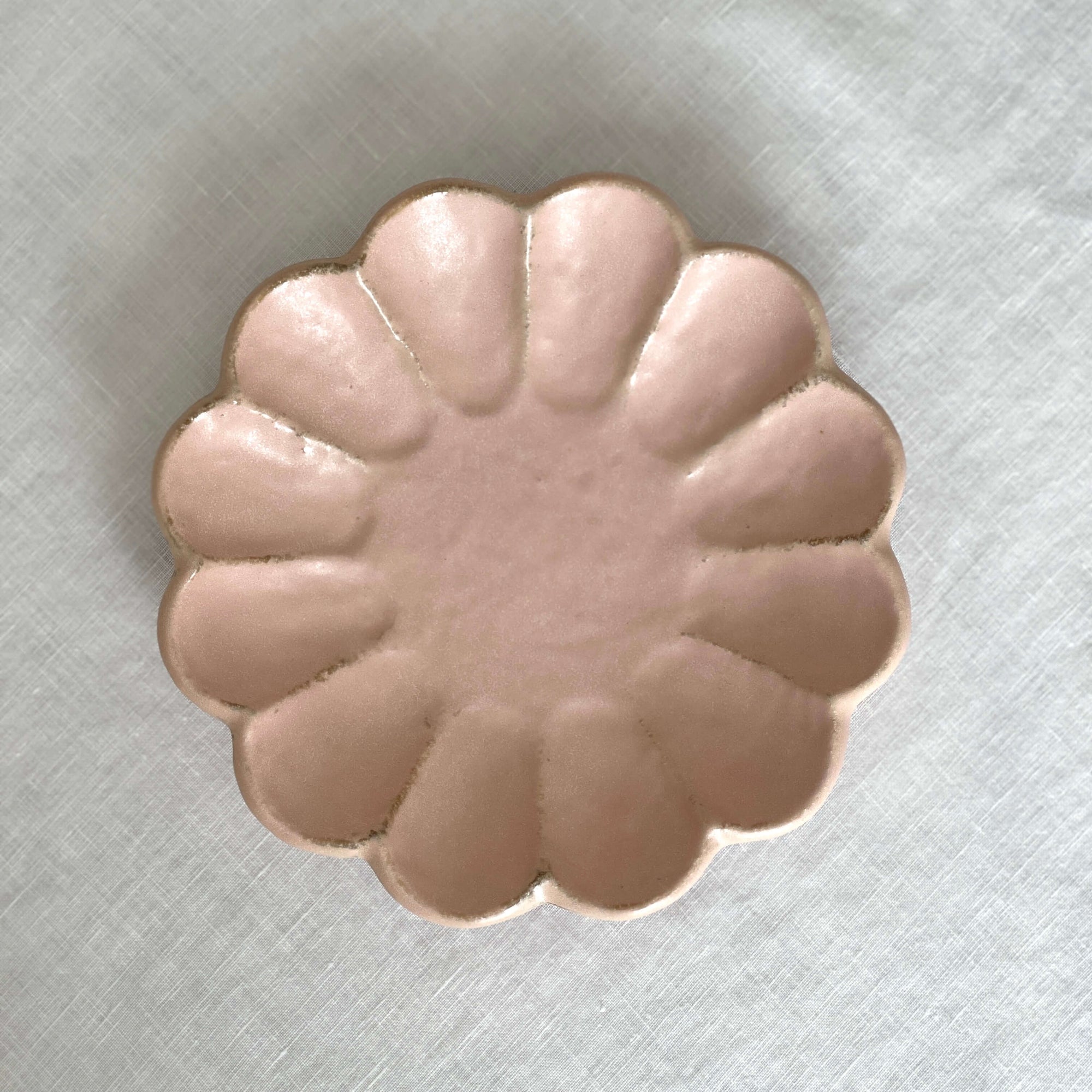 Elegant Rinka Plate 14cm in soft pink, handcrafted porcelain with floral design, perfect for enhancing table settings.
