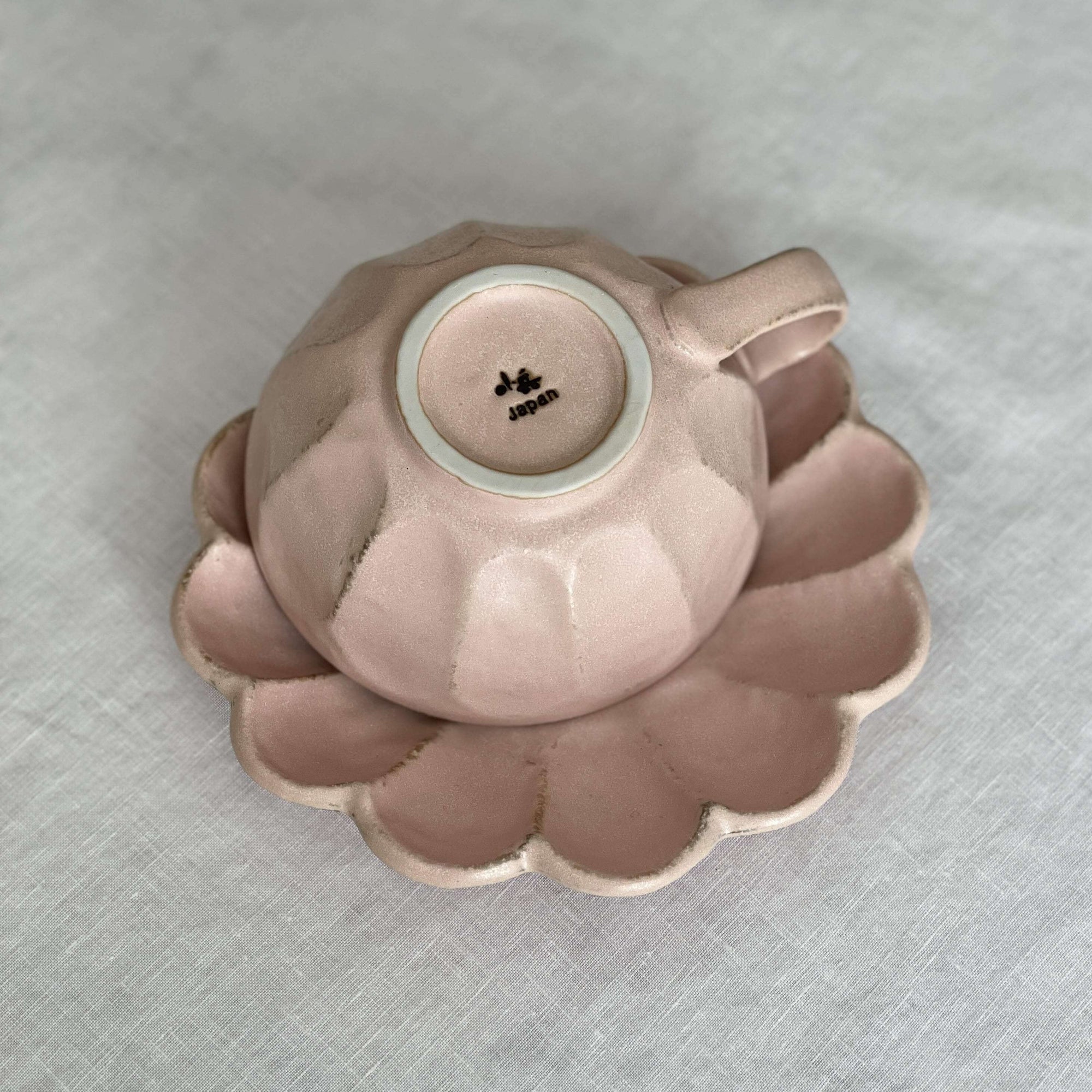 Pink Rinka soup cup with flower-shaped plate from Kaneko Kohyo, handcrafted porcelain, adds elegance and charm to any table setting.