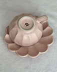Rinka Soup Cup in pink porcelain with flower shape, part of Kaneko Kohyo collection, elegantly displayed on matching saucer.