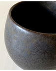 Textured black porcelain mug by Kaneko Kohyo, close-up view showing matte finish and elegant design, perfect for coffee or tea.