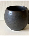 Rila Black Mug with textured porcelain finish from Kaneko Kohyo, microwave-safe, 340ml capacity, perfect for hand grip.