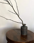 Shabby Chic Green Vase from Yoshida Pottery Collection on wooden table with branches, crafted by ceramist Masakazu Yoshida.