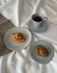Elegant table setting with pastries and tea on Storia plates, showcasing nostalgic and romantic porcelain tableware.