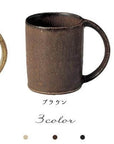 Three Kaneko Kohyo porcelain mugs in ivory, brown, and black colors, microwave-safe and stackable, displayed on a plain background.