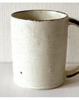 Rila Ivory Straight Mug, tastefully textured porcelain, microwave-safe, stackable, compact size, perfect for everyday use.