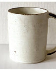 Rila Ivory Straight Mug, tastefully textured porcelain, microwave-safe, stackable, compact size, perfect for everyday use.