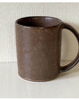 Brown porcelain straight mug by Kaneko Kohyo, Japan, with a matte finish and textured design.