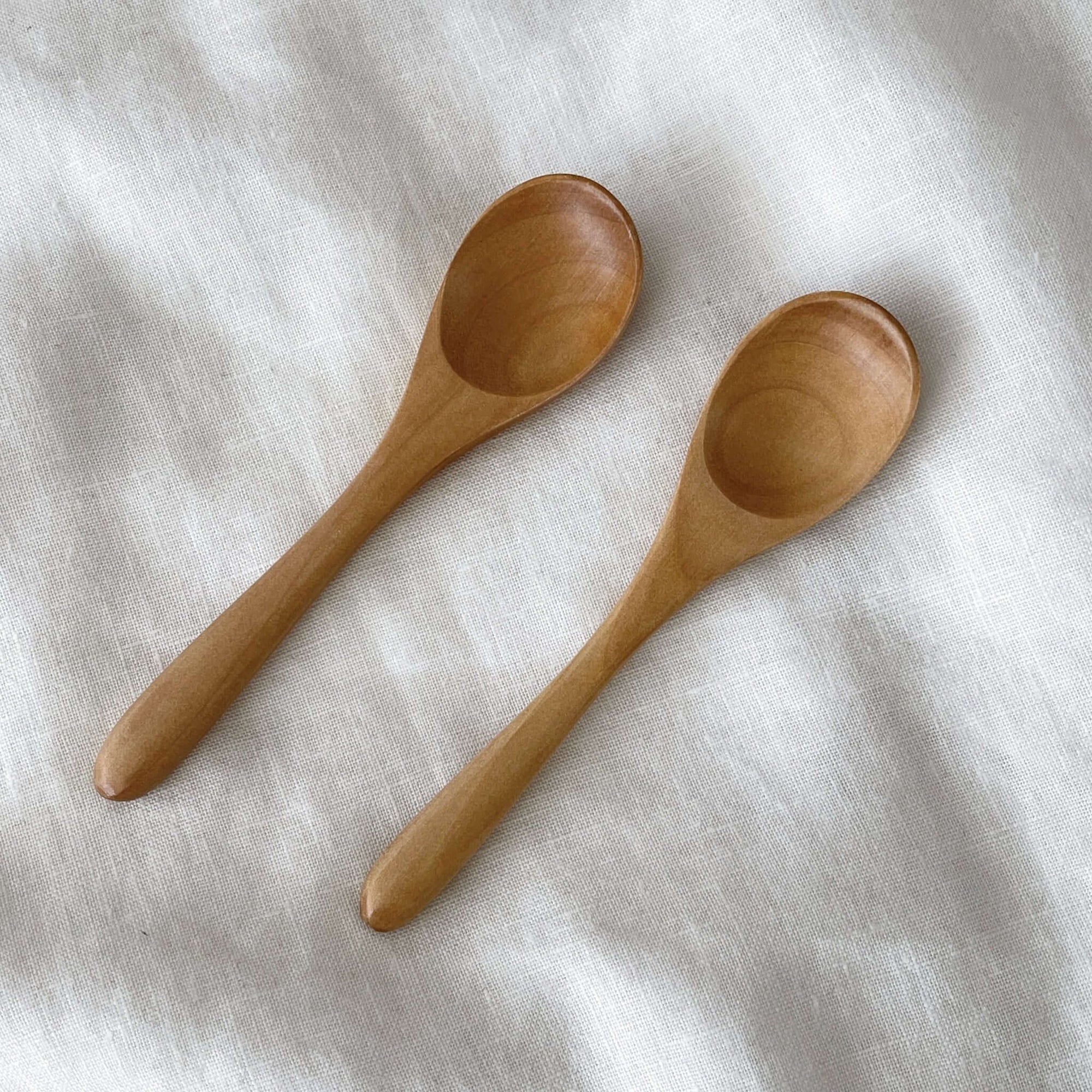 Wooden spoons 15.4cm on white background, perfect for soup and kids, made from natural wood, dishwasher safe.