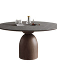 Solid wood round dining table with minimalist Italian design, featuring an elegant tapered base and spacious top, showcasing fine craftsmanship.