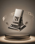 Metal rotating desk calendar showing its perpetual date dials — refined desk object by LoveÉcru