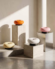 Halo Touch Lamps in orange, cream and pink on steel plinths