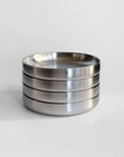 Noir Steel Plates stacked in a column of four, brushed satin finish