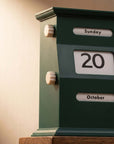 Green block Vintage Perpetual Desk Calendar showing Sunday 20 October, close-up