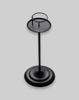 Tall Retro Iron Candlestick in black iron on a plain background