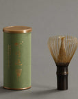 Artisan Bamboo Matcha Whisk in natural bamboo with its green storage tube