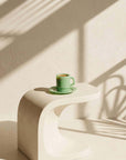 Mint Green Pastel Muse Mug with espresso on a curved stone table