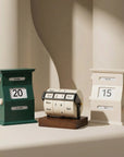 Vintage Perpetual Desk Calendars, green block, wheel and cream block, on a desk