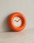 Orange Bagel Clock on a shelf