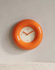 Orange Bagel Clock on a wall