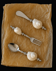 Shoreline Cutlery Set laid on brown paper, top view