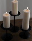 Retro Iron Candlestick 3-piece set with three lit ribbed candles