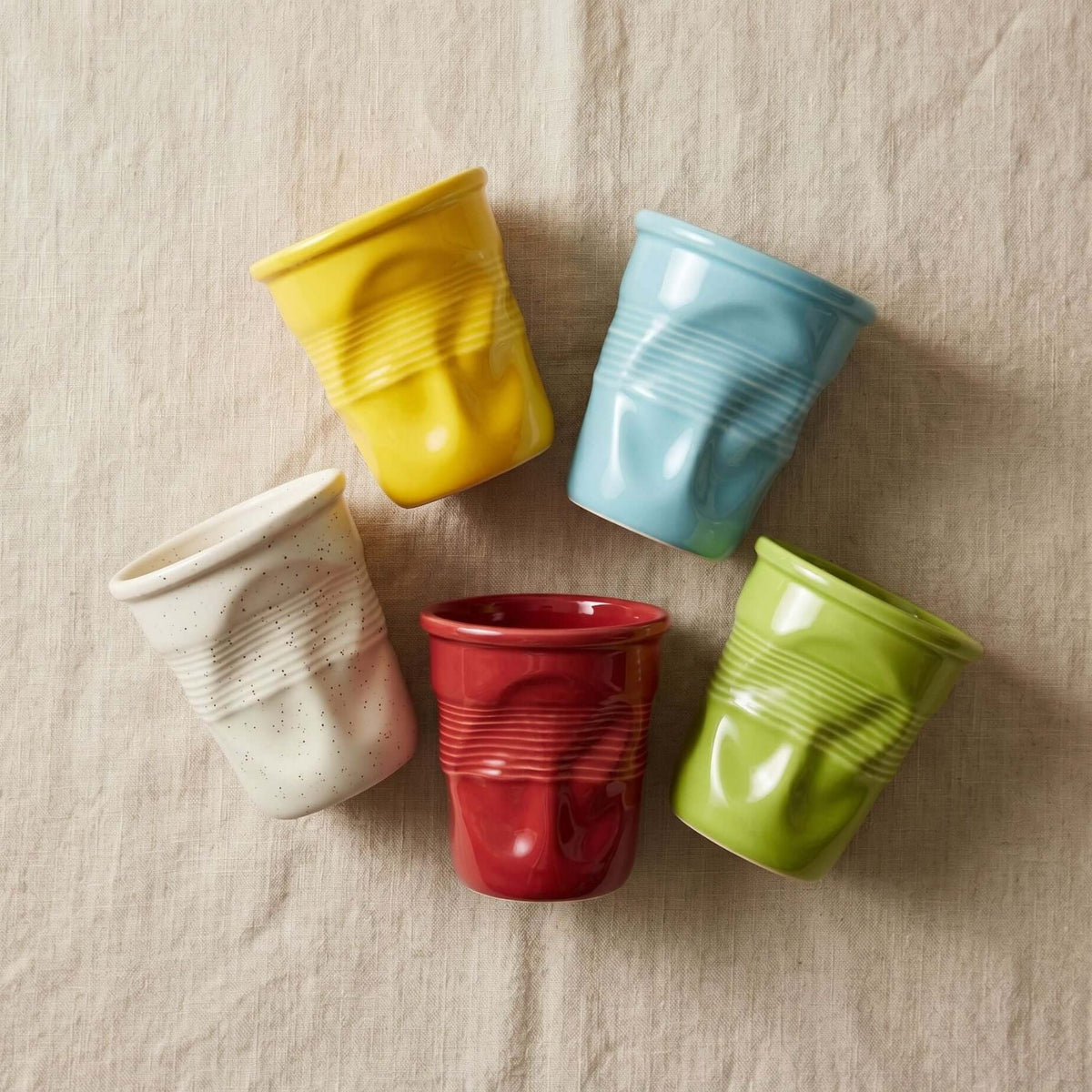 Crushed ceramic coffee mug with sculptural crumpled silhouette, 370 ml / 12 oz, by LoveÉcru