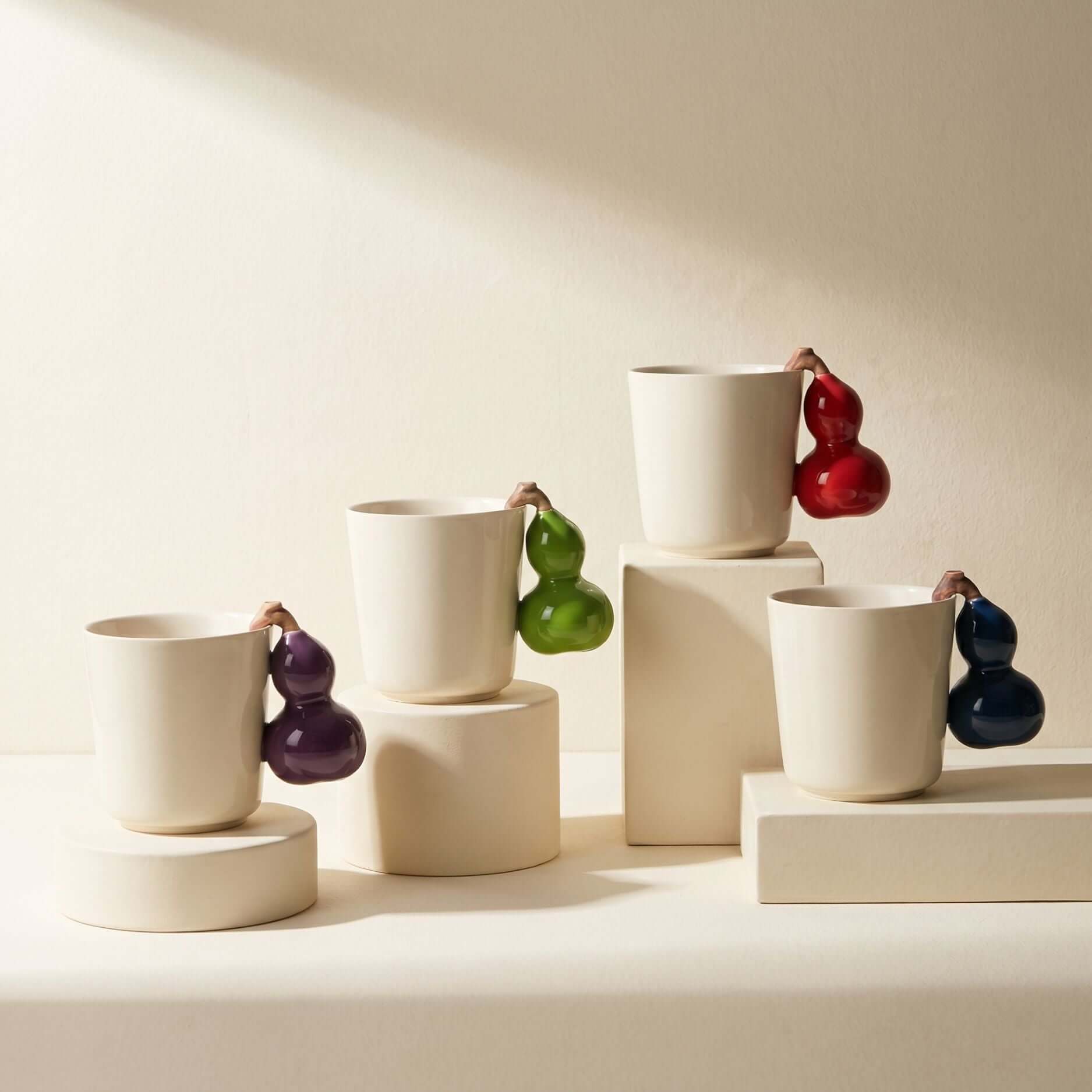 The four Fruit Handle Ceramic Mug colorways together