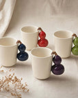 Fruit Handle Ceramic Mug styled with warm drinks