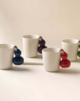 Fruit Handle Ceramic Mug in ivory with a sculptural fruit-shaped handle