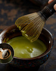 Whisking matcha in a bowl with the Artisan Bamboo Matcha Whisk