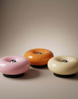 Halo Touch Lamps in pink, cream and orange, glossy donut-shaped lamps
