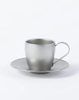 Stainless steel vintage cup and saucer set, featuring a sleek silver finish, made in Japan, perfect for elegant tea or coffee serving.