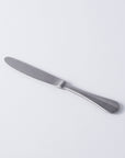 Vintage INOX Baguette Classic Dinner Knife with timeless design, suitable for casual to formal occasions.