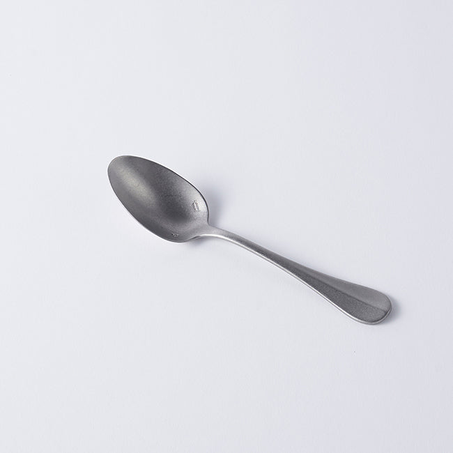 Vintage Inox Baguette Classic Series stainless steel spoon with elegant handle design on white background.