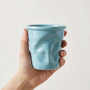 Blue Crushed Ceramic Mug held in a hand
