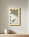 Cream White Onda Wave Mirror on a stone plinth