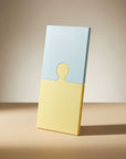 Lemon Sea Salt Puzzle Pop Chopping Board, yellow and white, standing upright